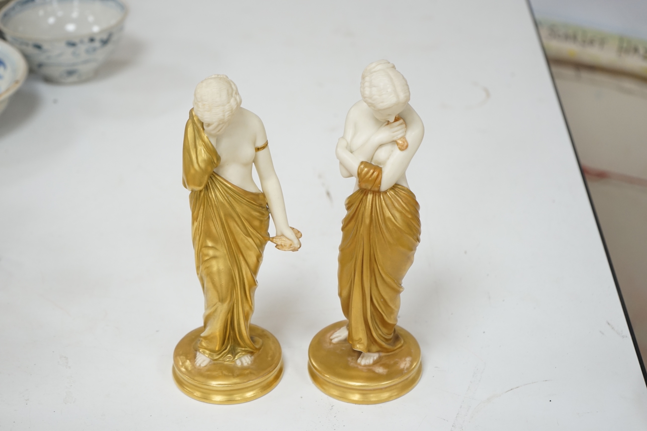 A pair of Royal Worcester porcelain figures, Joy and Sorrow, modelled by James Hadley, 2/57 & 2/47, 24cm. Condition - good